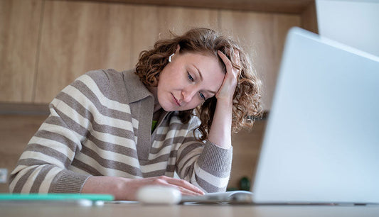 person feeling fatigued, a common sign of trace mineral deficiency.